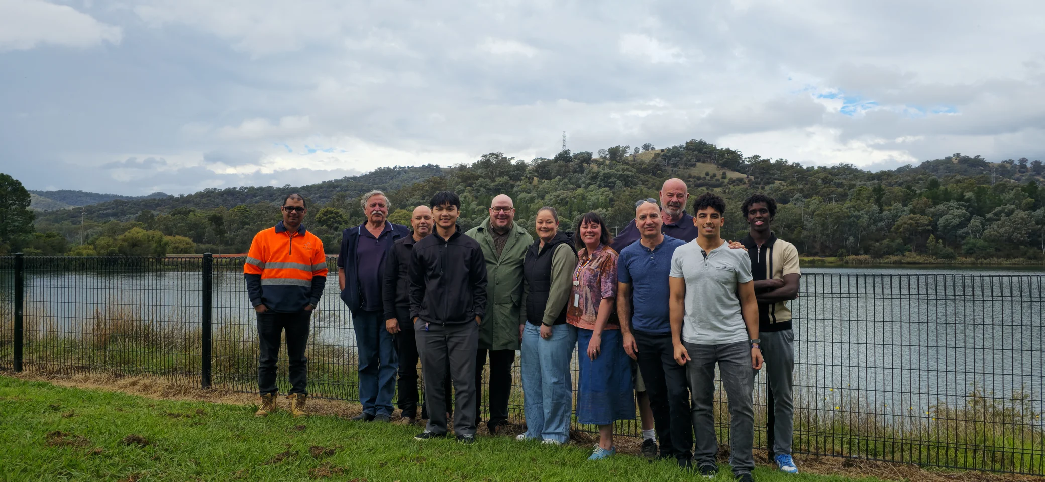 A group gathered beside the lake
